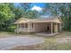 Brick ranch home with carport, mature trees, and a spacious yard at 2183 Highway 544, Conway, SC 29526