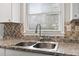 Modern double sink with a new faucet in the updated kitchen at 2183 Highway 544, Conway, SC 29526
