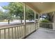 Inviting front porch with street view and white railings at 2183 Highway 544, Conway, SC 29526