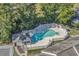Community pool with surrounding fence and lounge chairs at 1100 Possum Trot Rd. # C-101, North Myrtle Beach, SC 29582
