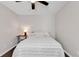Simple bedroom with ceiling fan, wood floors, and a neutral color scheme at 1100 Possum Trot Rd. # C-101, North Myrtle Beach, SC 29582