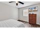 Bedroom with a TV, dresser, and ceiling fan at 1100 Possum Trot Rd. # C-101, North Myrtle Beach, SC 29582