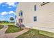Ground level entrance with steps leading up to a door at 1100 Possum Trot Rd. # C-101, North Myrtle Beach, SC 29582