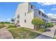 Well-maintained building exterior with landscaping and walkway at 1100 Possum Trot Rd. # C-101, North Myrtle Beach, SC 29582