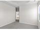Bright bedroom with grey carpet and access to hallway at 3059 Deerberry Place, Longs, SC 29568