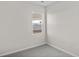 Well-lit bedroom featuring grey carpet and a window at 3059 Deerberry Place, Longs, SC 29568