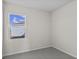Bright bedroom with grey carpet and a window offering an exterior view at 3059 Deerberry Place, Longs, SC 29568