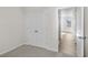 Bedroom with double doors leading to a closet and view of hallway at 3059 Deerberry Place, Longs, SC 29568