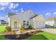 Front view of a charming new home with a welcoming porch and nicely landscaped lawn at 3059 Deerberry Place, Longs, SC 29568