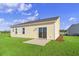 Charming yellow house with sliding glass door and backyard at 3059 Deerberry Place, Longs, SC 29568