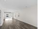 Open concept kitchen and living room with island and hardwood-look floors at 3059 Deerberry Place, Longs, SC 29568