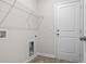 Laundry room with shelving and door to exterior at 3059 Deerberry Place, Longs, SC 29568