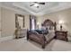 Comfortable bedroom with a wooden bed frame and ample floor space at 1563 Cadiz Dr., Myrtle Beach, SC 29579