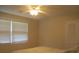 Bedroom with ceiling fan, double windows, and a bed at 3922 Spruce Dr. # 3922, Myrtle Beach, SC 29577