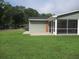 Home exterior with a screened porch and grassy yard at 3922 Spruce Dr. # 3922, Myrtle Beach, SC 29577