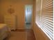 Bedroom with a dresser, ensuite bathroom, and window at 3922 Spruce Dr. # 3922, Myrtle Beach, SC 29577