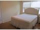 Simple bedroom with white bedding and a white headboard at 3922 Spruce Dr. # 3922, Myrtle Beach, SC 29577