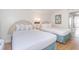 Well-lit bedroom featuring two double beds and an ensuite bathroom at 2207 S Ocean Blvd. # 1516, Myrtle Beach, SC 29577