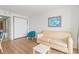 Living room featuring a light beige couch and a small table at 2207 S Ocean Blvd. # 1516, Myrtle Beach, SC 29577