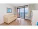 Living room with ocean view and light beige couch at 2207 S Ocean Blvd. # 1516, Myrtle Beach, SC 29577