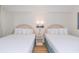 Bright bedroom with two double beds, nightstands, and ample lighting at 2207 S Ocean Blvd. # 1516, Myrtle Beach, SC 29577