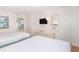 Spacious bedroom with two double beds, dresser, and view of kitchenette at 2207 S Ocean Blvd. # 1516, Myrtle Beach, SC 29577