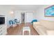 Light and airy living room with sofa and dining area at 2207 S Ocean Blvd. # 1516, Myrtle Beach, SC 29577
