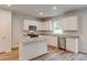 Modern kitchen with island, white cabinets, and granite countertops at 839 Laconic Dr., Myrtle Beach, SC 29588