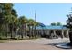Gated community entrance with a guardhouse and landscaping at 669 Retreat Beach Circle # C2G, Pawleys Island, SC 29585