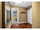 Condo foyer with hardwood floors, mirror, and entry to another room at 669 Retreat Beach Circle # C2G, Pawleys Island, SC 29585