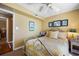 Bedroom with full bed and yellow walls at 669 Retreat Beach Circle # C2G, Pawleys Island, SC 29585