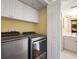 Convenient laundry room with Whirlpool washer and dryer at 669 Retreat Beach Circle # C2G, Pawleys Island, SC 29585