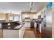 Modern kitchen with island, granite countertops, and stainless steel appliances at 669 Retreat Beach Circle # C2G, Pawleys Island, SC 29585