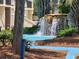 Landscaped waterfall feature with a small pond at 669 Retreat Beach Circle # C2G, Pawleys Island, SC 29585