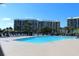 Inviting swimming pool with plenty of lounge chairs at 669 Retreat Beach Circle # C2G, Pawleys Island, SC 29585