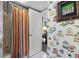 Multicolored striped shower curtain and bird wallpaper at 669 Retreat Beach Circle # C2G, Pawleys Island, SC 29585