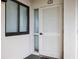 Condo entry with white door and two windows with blinds at 669 Retreat Beach Circle # C2G, Pawleys Island, SC 29585