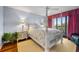 Charming bedroom with a post bed, ocean view, and plenty of natural light at 669 Retreat Beach Circle # C2G, Pawleys Island, SC 29585