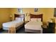Bedroom with two twin beds, nightstand, and small table at 2701 S Ocean Blvd. # 310, North Myrtle Beach, SC 29582