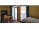 Bedroom with two twin beds and access to balcony at 2701 S Ocean Blvd. # 310, North Myrtle Beach, SC 29582