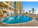 Resort-style pool with plenty of lounge chairs at 2701 S Ocean Blvd. # 310, North Myrtle Beach, SC 29582