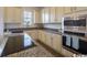 Kitchen with granite countertops, stainless steel appliances, and ample cabinet space at 2810 Cook Circle # D, Myrtle Beach, SC 29577
