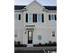 Front view of a light-colored townhome with black shutters and door at 2810 Cook Circle # D, Myrtle Beach, SC 29577