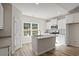 Modern kitchen with white cabinets, granite countertops, and an island at 310 Chaff Ct., Georgetown, SC 29440