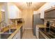 Modern kitchen featuring stainless steel appliances and granite countertops at 4370 Crepe Myrtle Ct. # F, Murrells Inlet, SC 29576