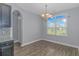 Bright dining area with hardwood floors and a chandelier at 1616 Sapphire Dr., Longs, SC 29568
