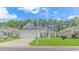 Gray house with a white garage door and blue shutters at 1616 Sapphire Dr., Longs, SC 29568