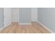 Bedroom with wood-look floors and a spacious closet at 1616 Sapphire Dr., Longs, SC 29568