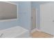 Bathroom with soaking tub, shower, and updated fixtures at 1616 Sapphire Dr., Longs, SC 29568