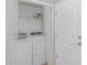 Laundry room with washer, dryer, and shelving at 1616 Sapphire Dr., Longs, SC 29568